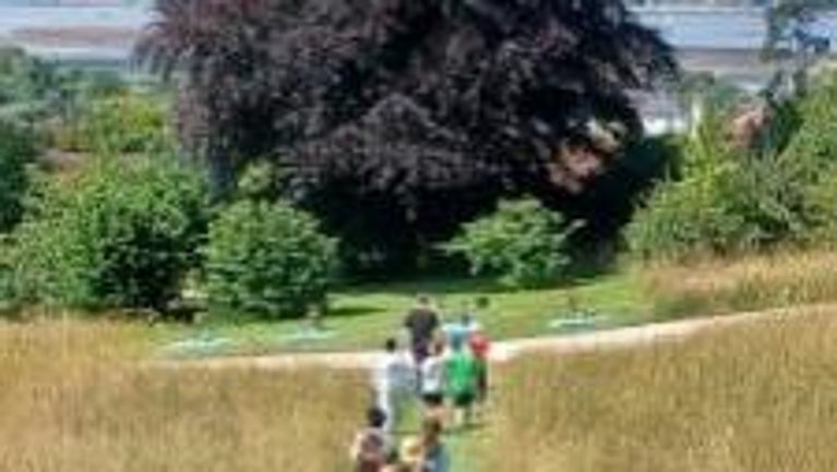 Children learning about Devon’s rivers and water filtration with specialist Richard Irvine